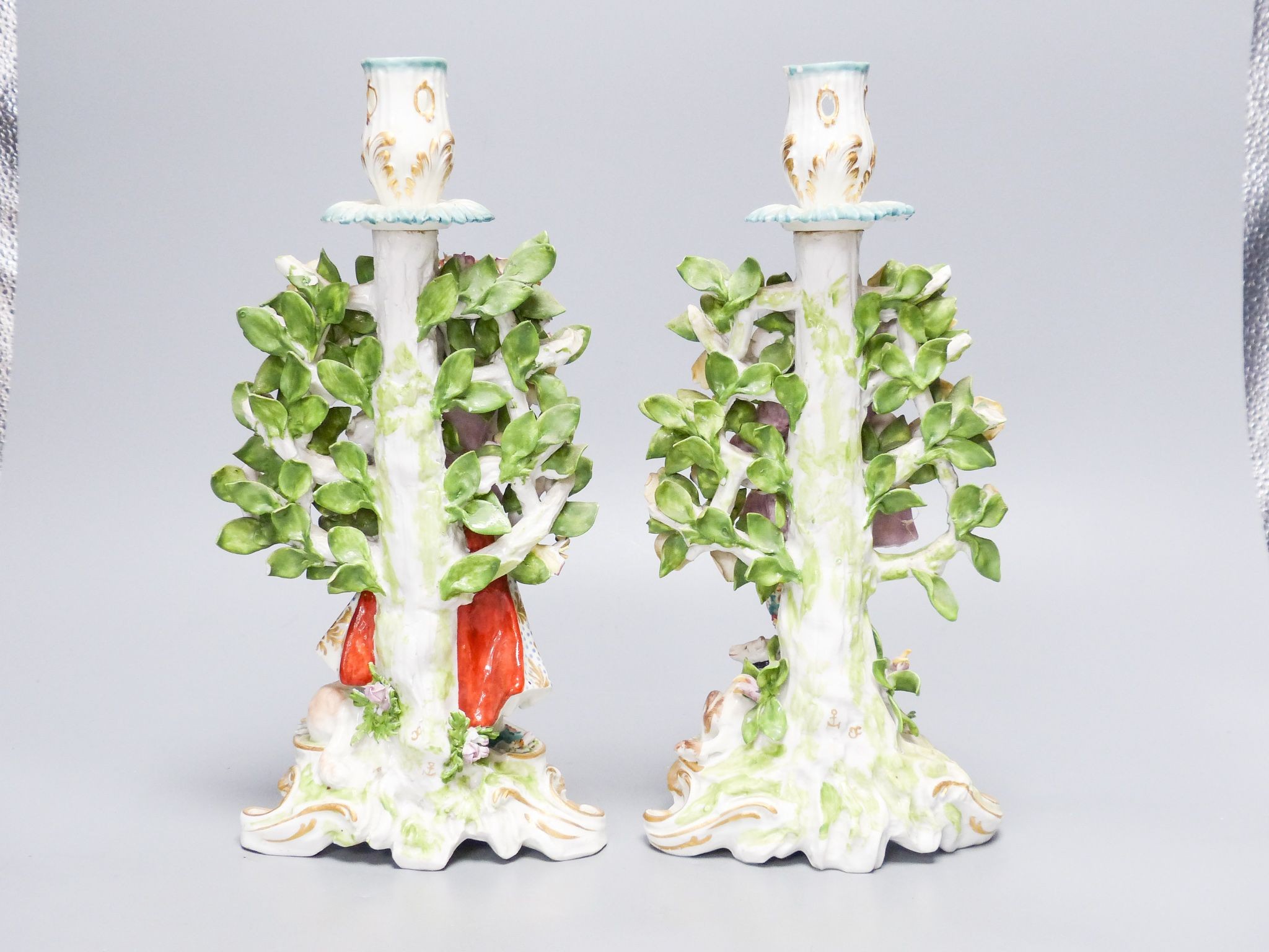 A pair of Derby style candlestick figures, height 27cm